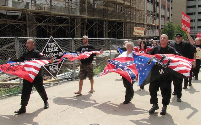Racist carrying neo-Nazi flags
